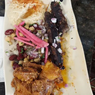 Kefta Platter with chickpea salad, hummus, and spicy potatoes