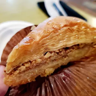 a hand holding a pastry