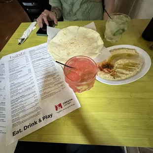 Strawberry lemonade vodka drink with pita and hummus