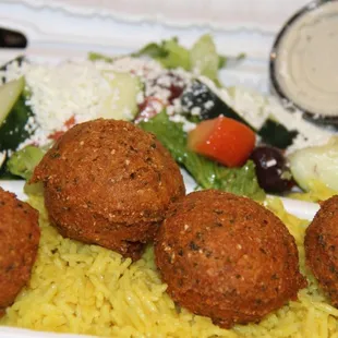 a salad and three meatballs
