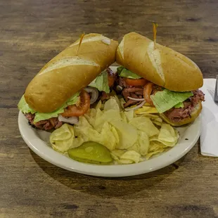 Whole Beef Pastrami Sub with chips and pickles