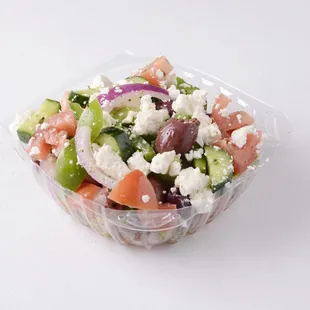 a salad in a plastic container