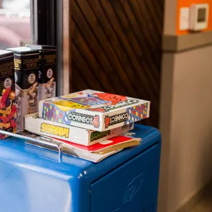 a stack of snacks on top of a blue cooler