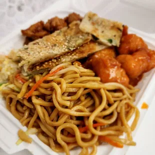 Cow mein, oange chicken, and Kung Pao chicken in back. Seseme bread on top. Definitely get the orange chicken!