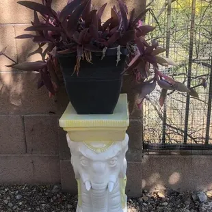 Ceramic elephant stand