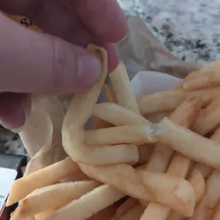 Soggy french fry that I can completely bend.