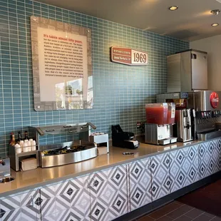 a counter with a menu on it