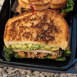 One half of the chicken club sandwich