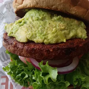 Vegan Burger with no cheese and filled with guacamole.