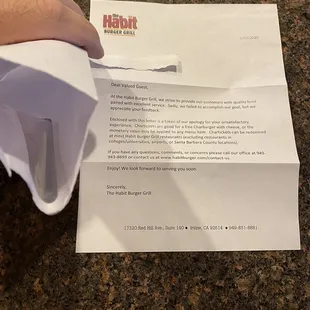 a hand holding a piece of paper