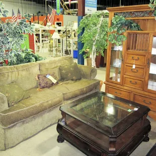 New and gently used entertainment centers, couches, and tables.