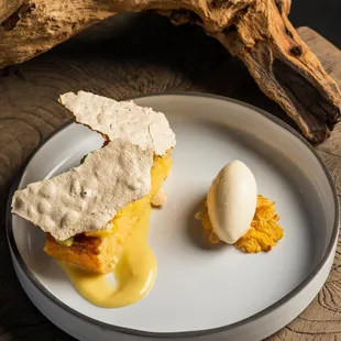 a plate of food on a wooden table