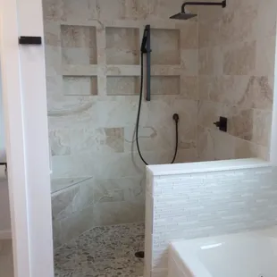 a walk - in shower and a bathtub