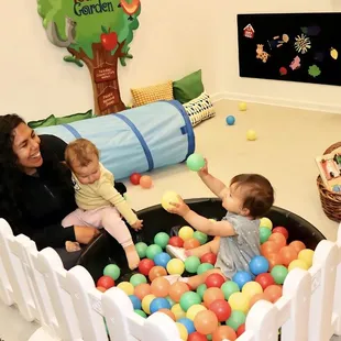 Children playing in our infant/toddler garden for babies and early walkers