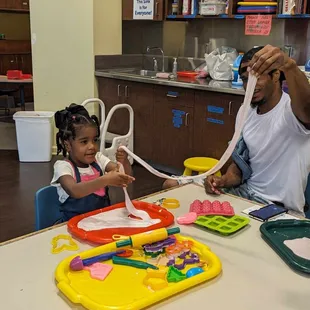 Family time playing with slime at Habitot.