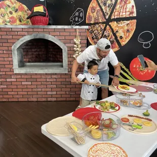 Father and son making "pizza" together