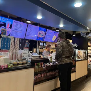 a man ordering food at a restaurant