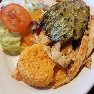 Chicken fajita plate w/ side of refried beans, rice, salad and nopal
