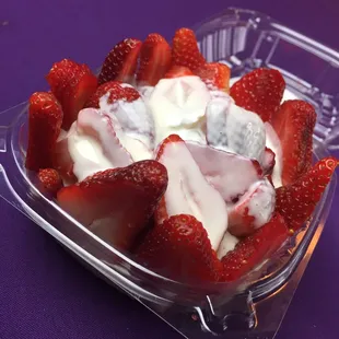 a bowl of strawberries and yogurt