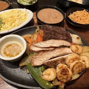 Chicken and steak fajitas with grilled shrimp added on