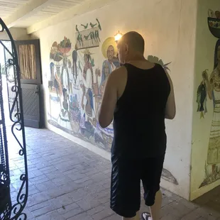 Exploring the paintings in the entry corridor