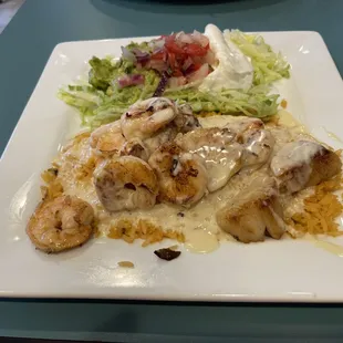Shrimp and scallops with cheese and rice