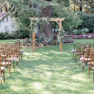 An outdoor ceremony set up awaiting guests to arrive.