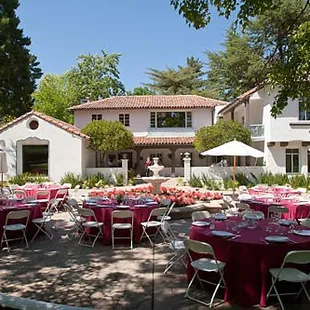 A vibrant outdoor reception set up.