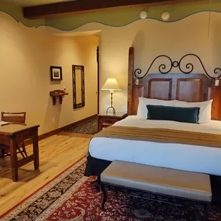 View of bed from balcony door.