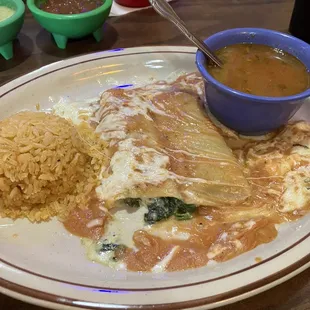 Spinach enchiladas and chicken tacos.