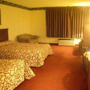 2 queen non-smoking room - $27! Lots of space. That window over looked the pool/hot tub and a small hill outside.