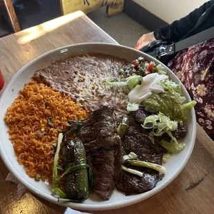 Carne Asada plate with rice and beans