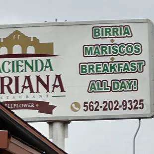 Rooftop sign on restaurant.