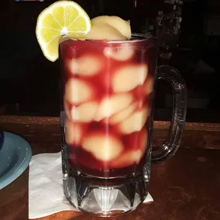 a drink with a slice of lemon