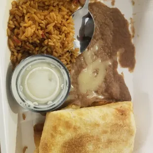 That's a teaspoon, not a tablespoon to show the portions.  Ridiculous, especially when the rice and beans are cheap filler foods.