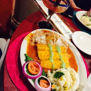 Enchiladas dressed in the house salsa verde and Margarita San Miguelito. Delicious!