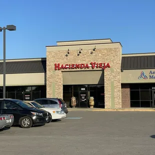 a parking lot with several parked cars