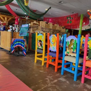 brightly painted chairs and tables
