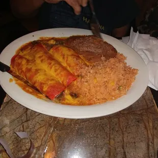 Beef enchilada plate with refried beans and Mexican rice