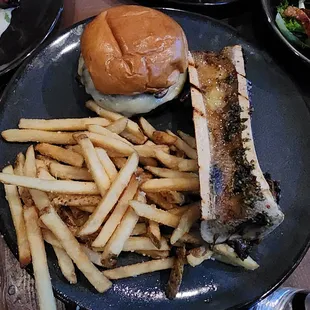 AL CZERVIK: beef patty, roasted bone marrow, demi mushrooms, and Swiss cheese, brioche bun. Fries sold separately.