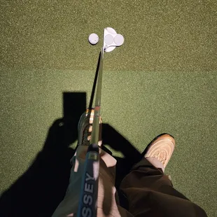 a person holding a golf club