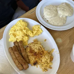 Egg and hash brown casserole breakfast with sausage and biscuits and gravy.