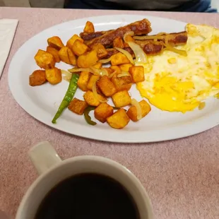 Over medium eggs, bacon, and home fries