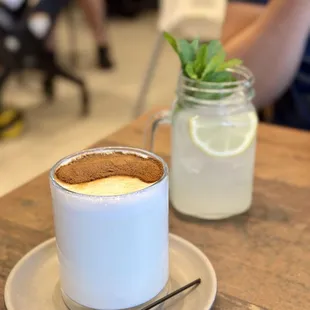 a cup of coffee and a jar of lemonade