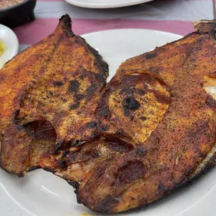 two pieces of fish on a plate