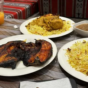 three plates of food on a table