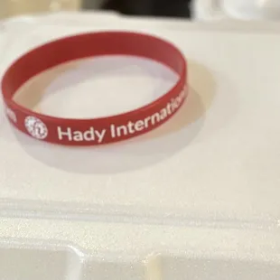 a red rubber bracelet