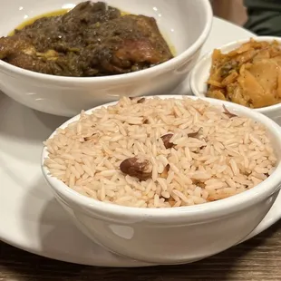 Curry chicken, rice and peas, and cabbage