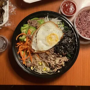 Bibimbap, chopped lettuce is on the bottom to protect it.