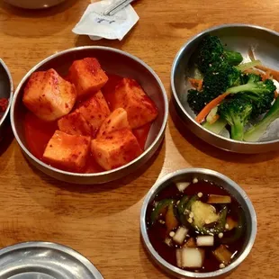 a variety of bowls of food on a table